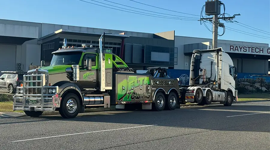 Delta Heavy Towing operators preparing a heavy recovery unit